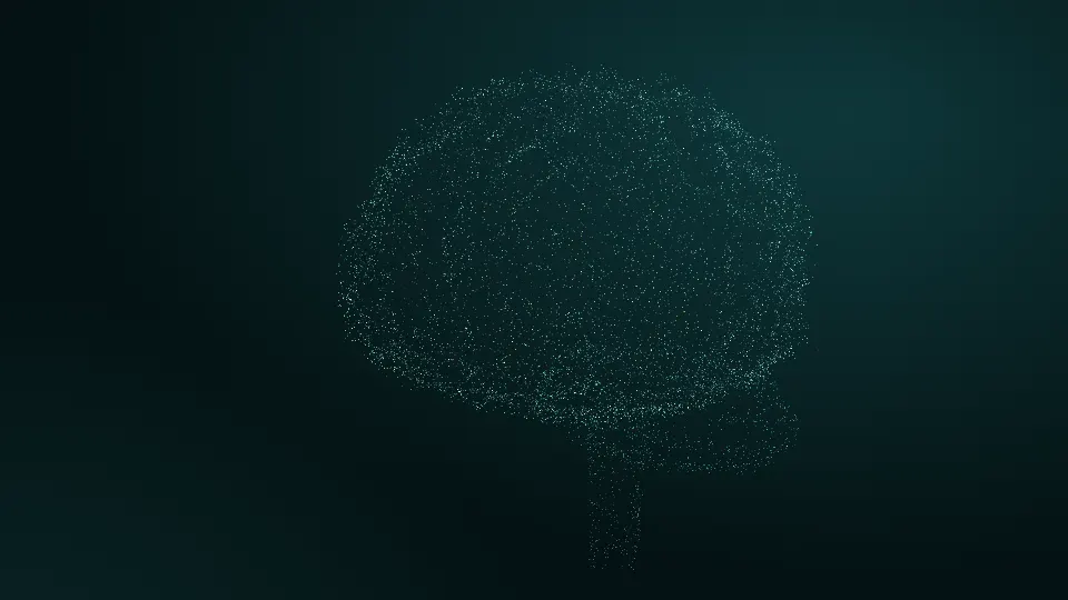 Thousands of mint particles forming the shape of a human brain on a dark teal background
